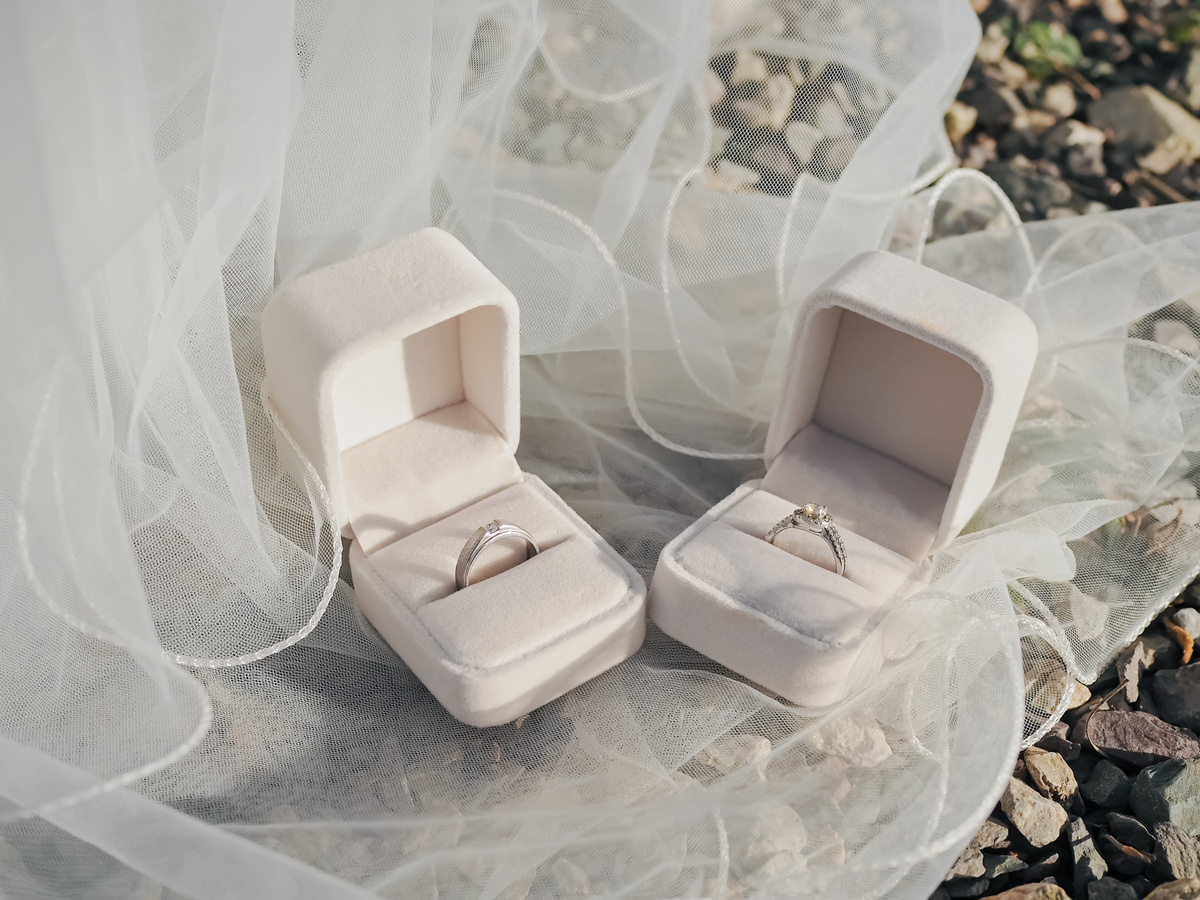 Wedding accessories. Diamondengagement wedding rings on white box. Valentine's day and Wedding day concept. Love signal